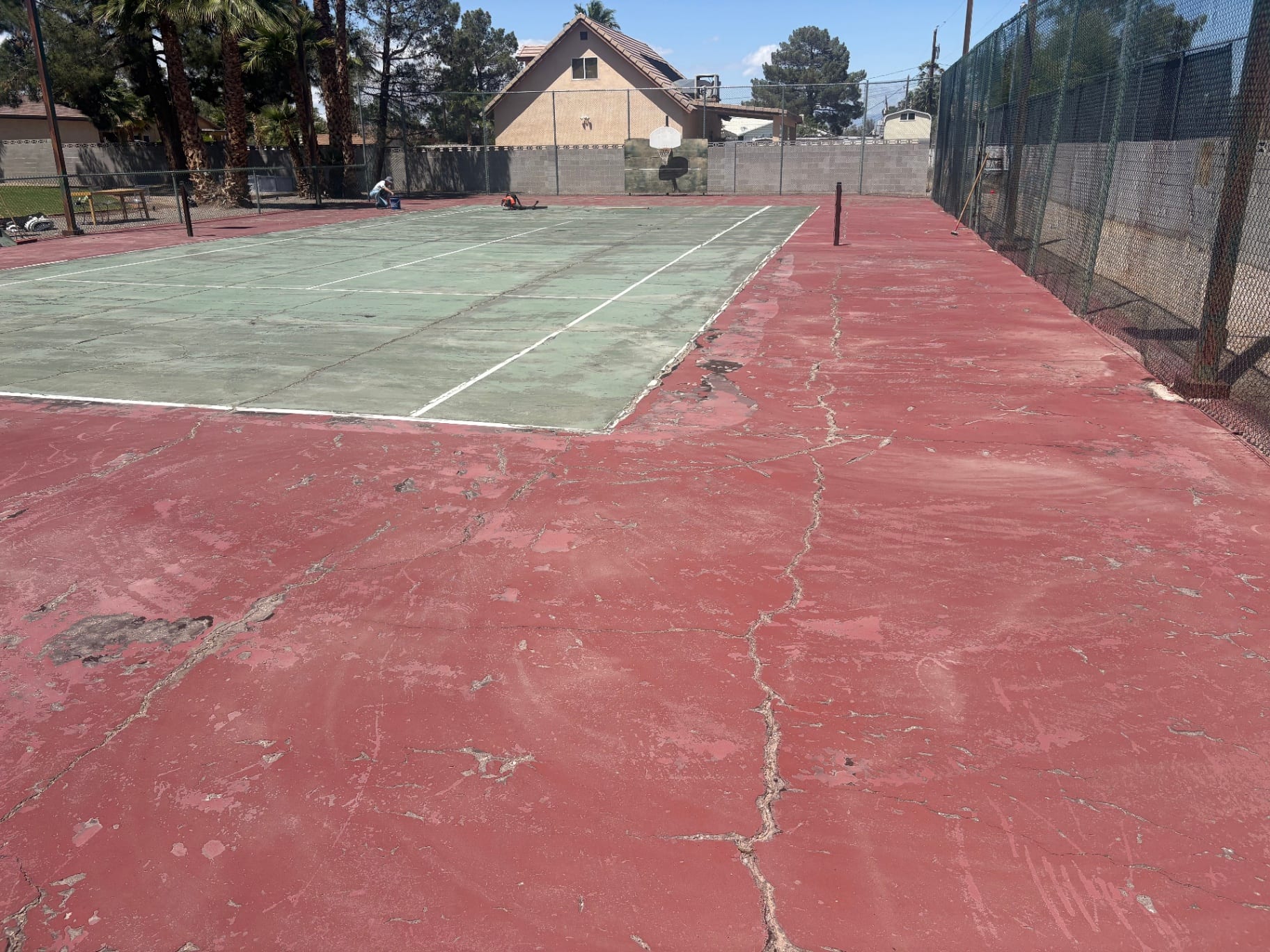 Before: Red and green tennis court resurfacing