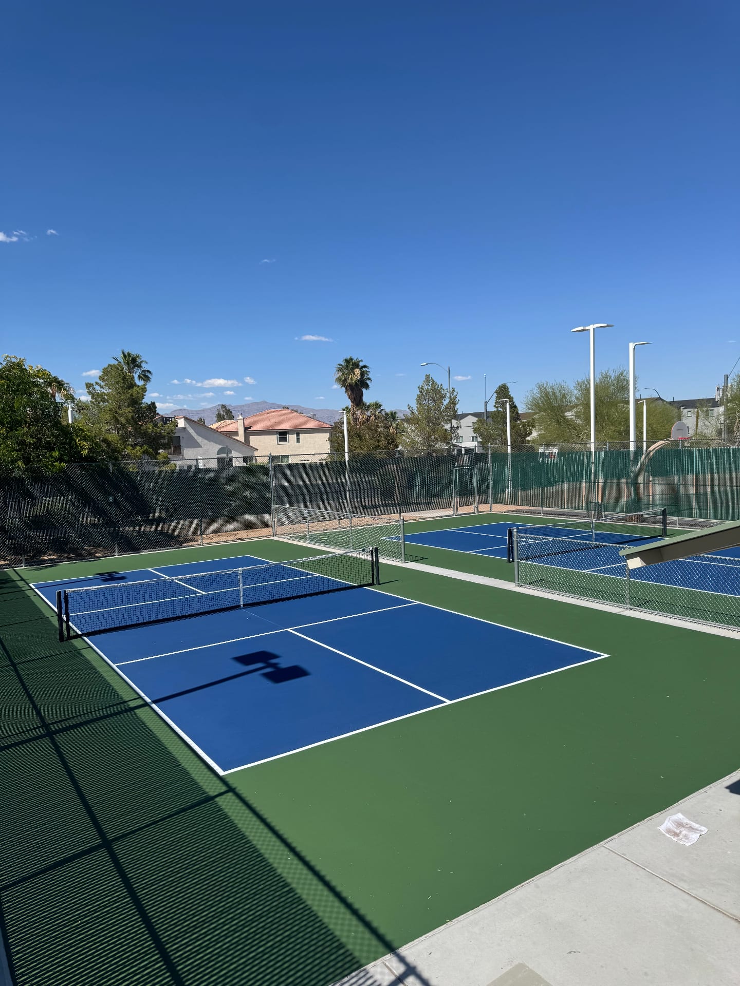 Two newly resurfaced blue and green pickleball courts at Durango Hills in Las Vegas