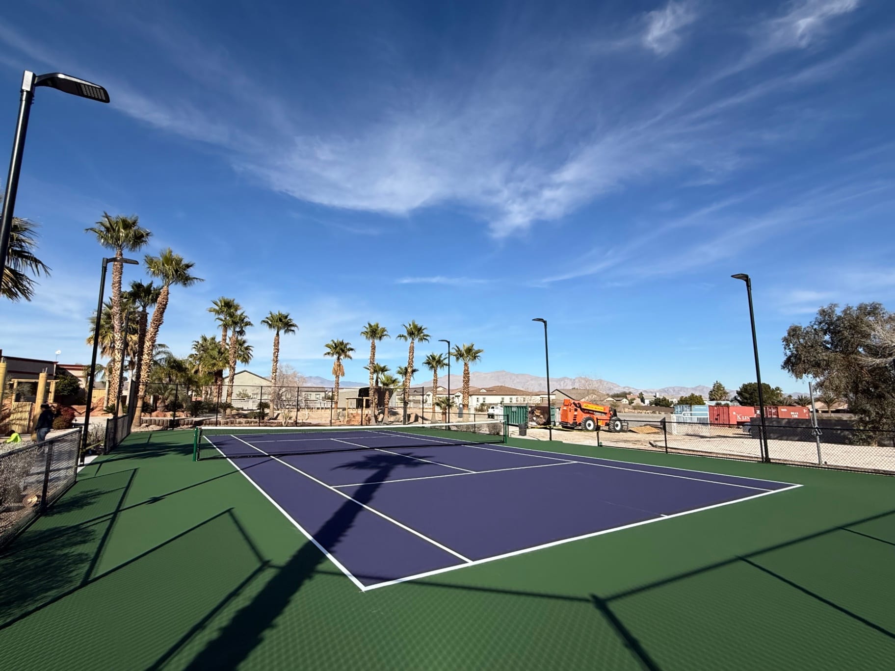 After: Tan concrete to green and purple court rebuild